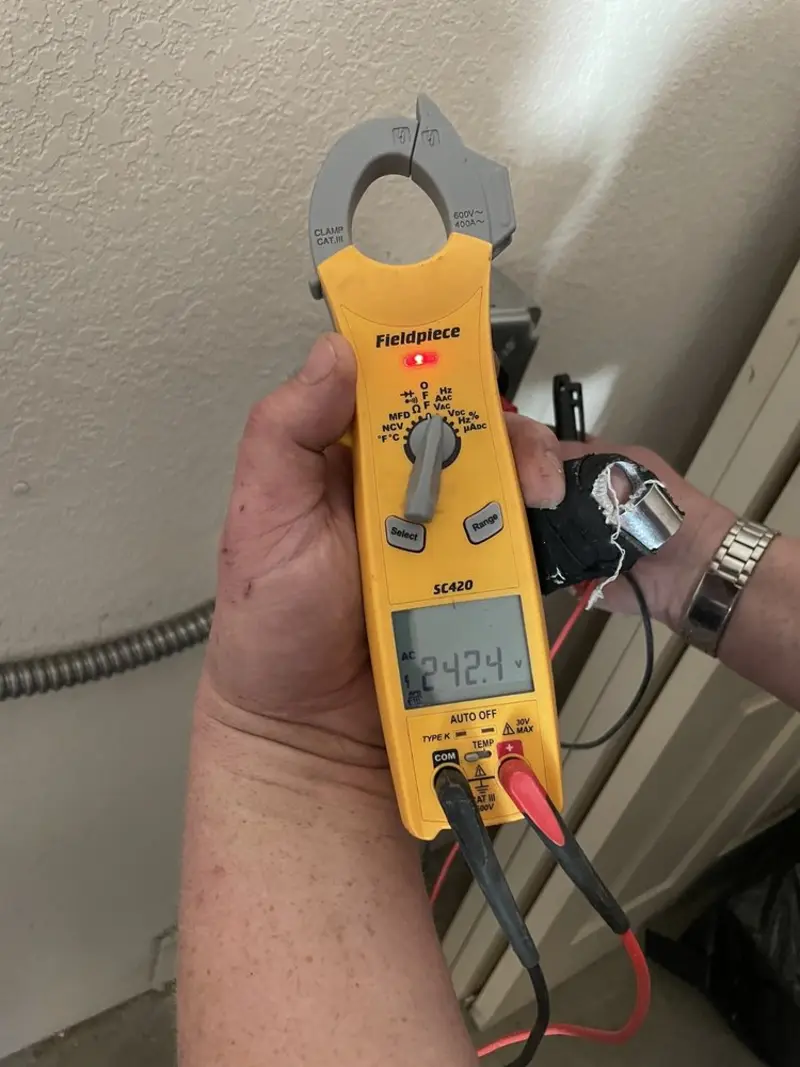 Voltage testing with clamp meter during Outlet Installation in Shaker Heights